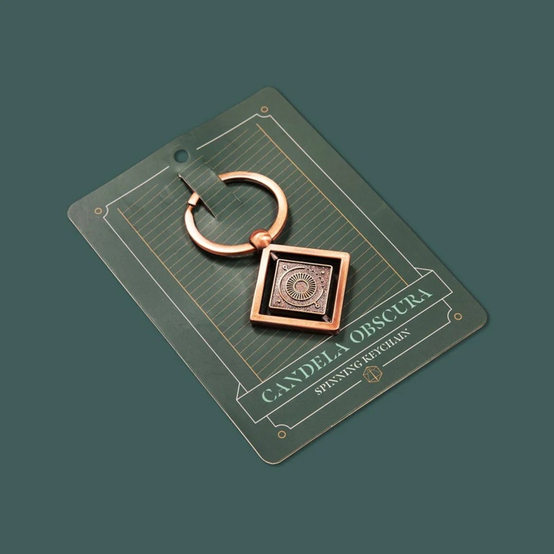 CANDELA OBSCURA SPINNING KEYCHAIN